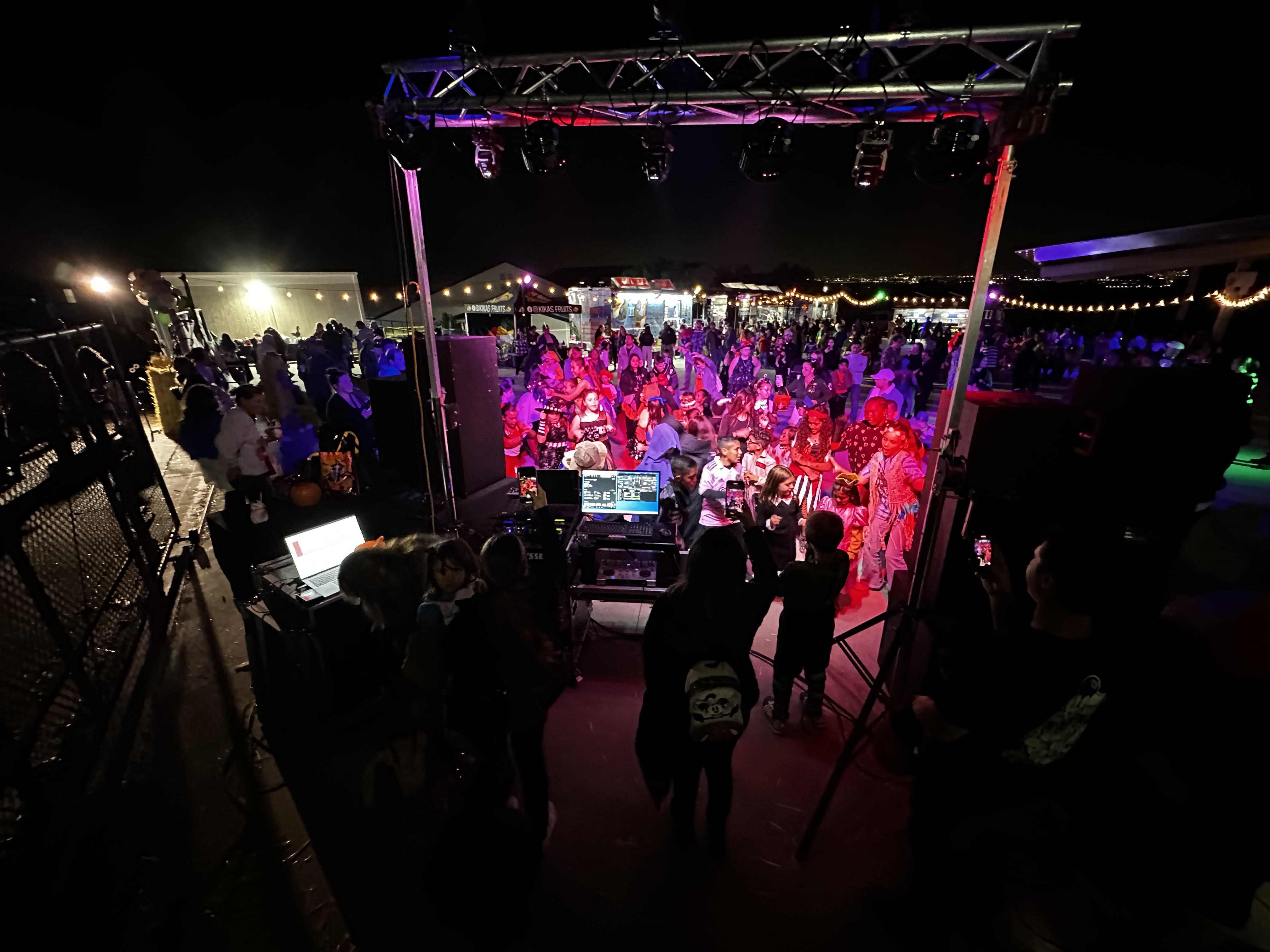 Professional DJ booth setup with turntables and mixer